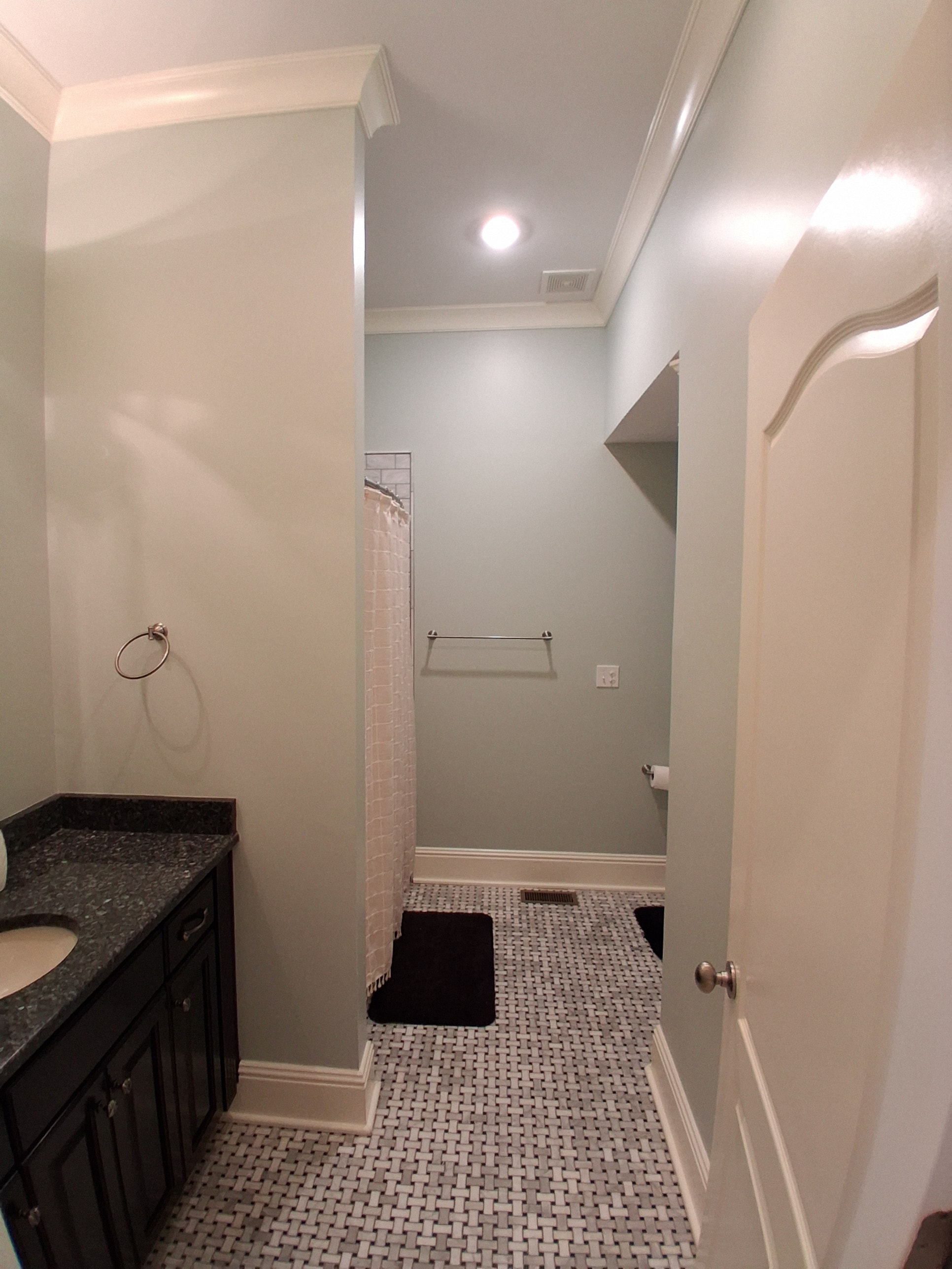 Bathroom with gray painted walls and tile