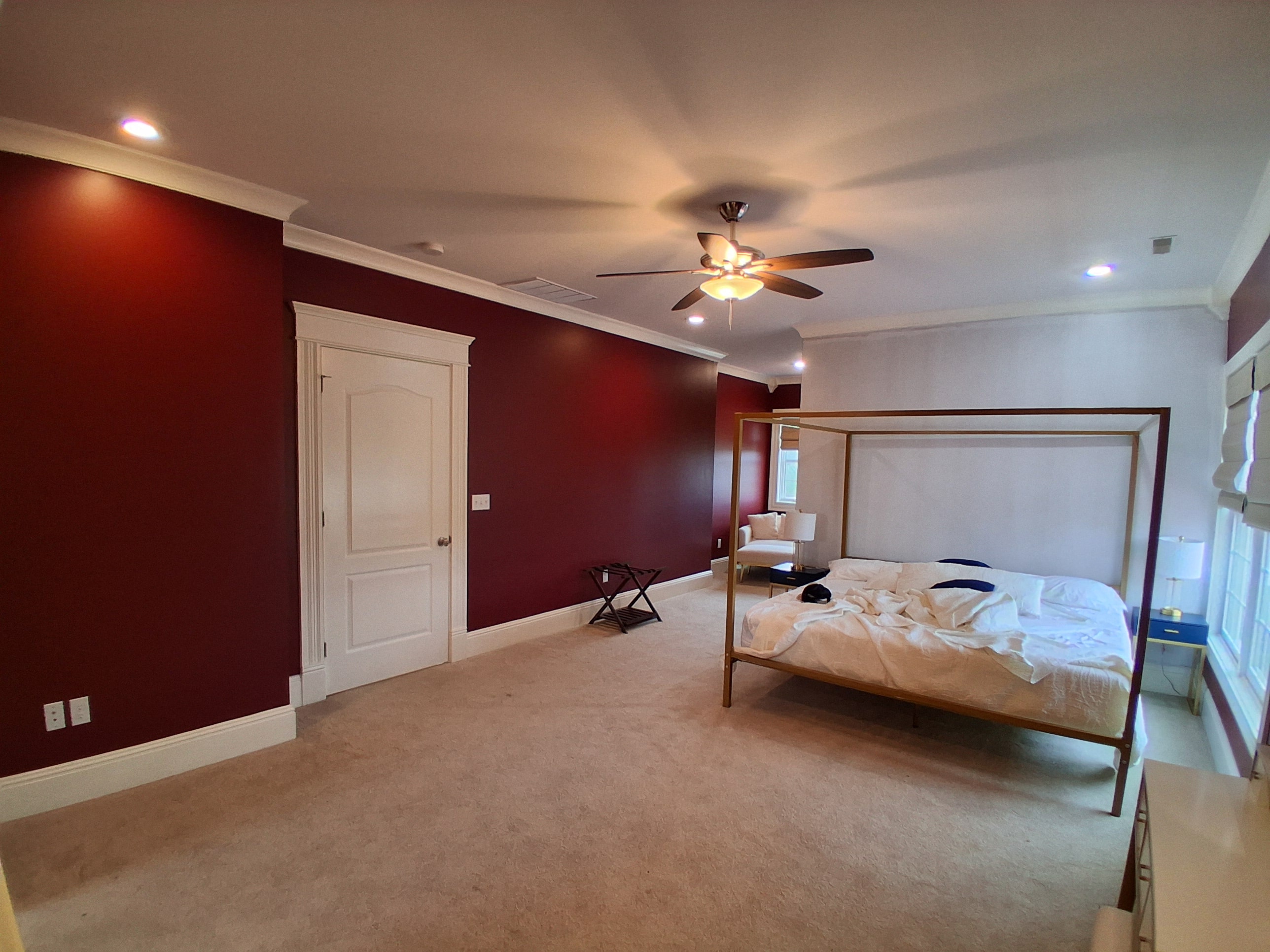 Bedroom with red accent wall